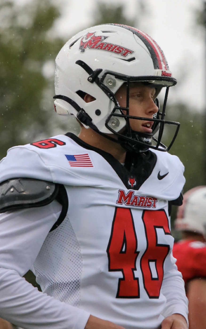 Luke Stenson in a Marist football uniform on the sideline